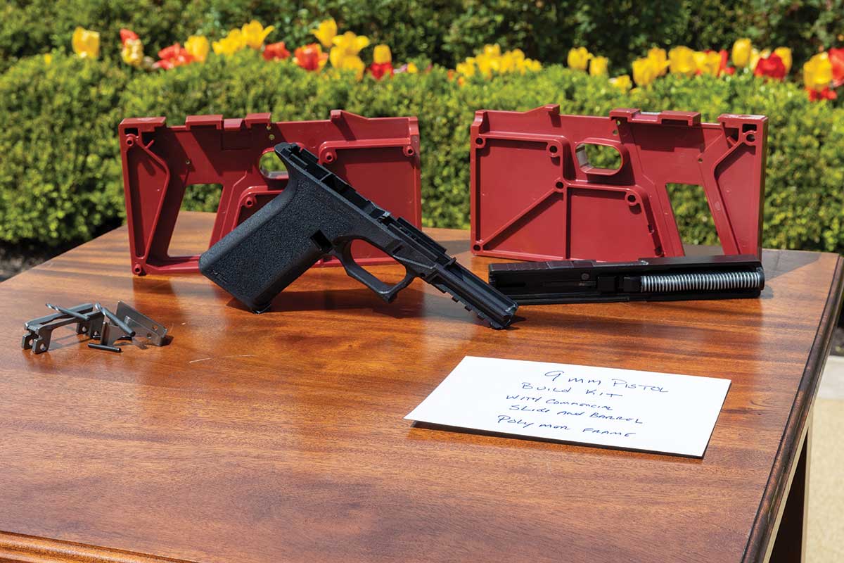 A 9mm pistol self-assembly kit is displayed during a Rose Garden event publicizing the Biden administration’s 2022 ghost-gun rules.