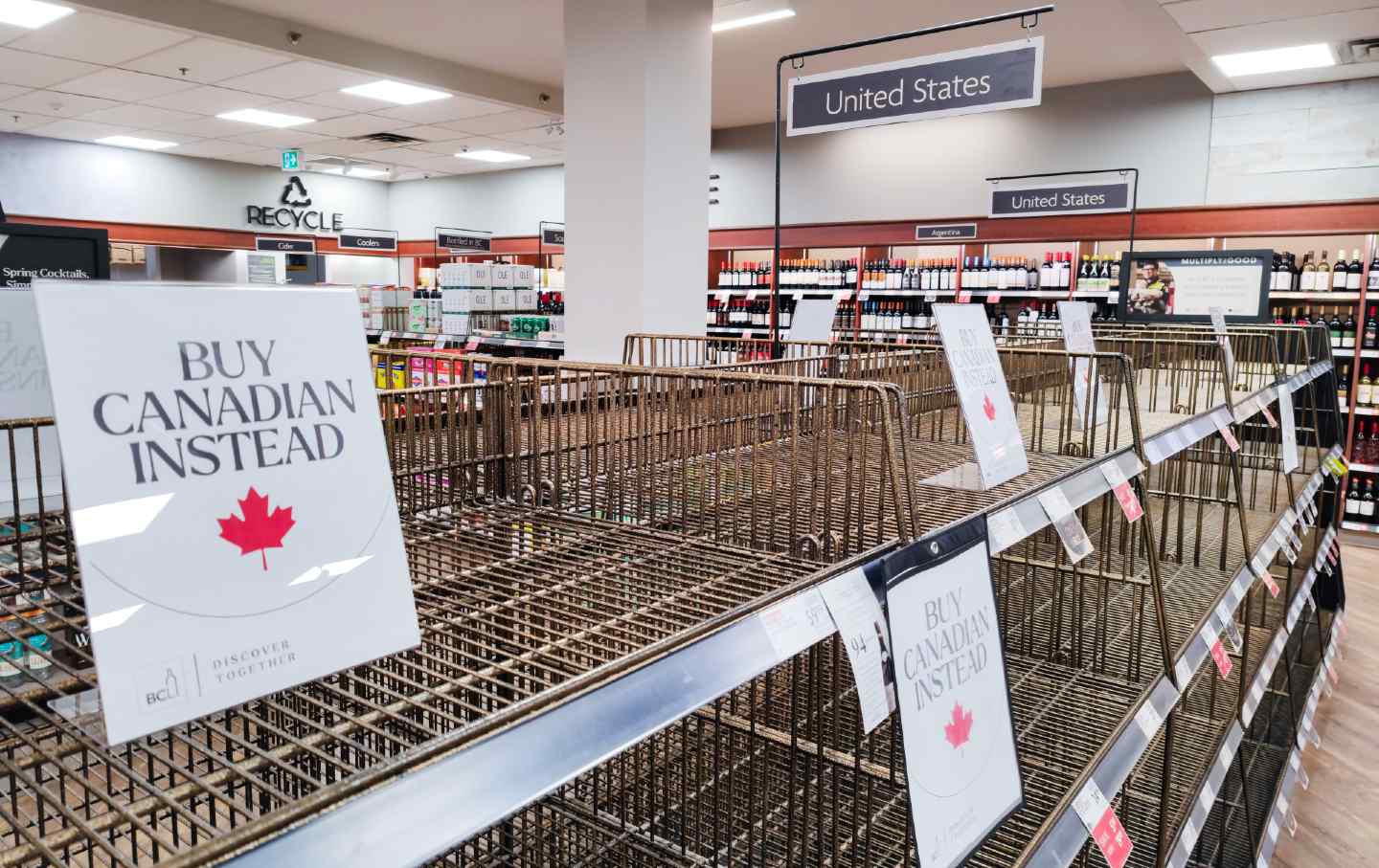 Tags reading “Buy Canadian Instead” are seen on the empty shelf of American products at a supermarket on March 28, 2025, in Vancouver, Canada.