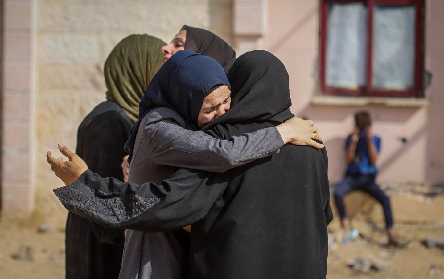 Relatives mourn after the bodies of Palestinians killed in Israeli air strikes were brought to a hospital.