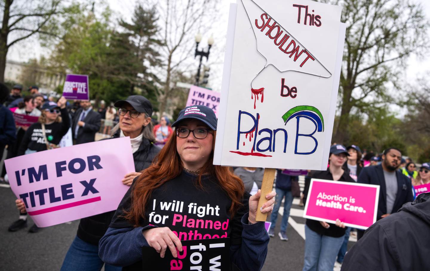 A pro-choice demonstrator holds a sign in front of the US Supreme Court Building as the “Medina v. Planned Parenthood South Atlantic” case is heard on Wednesday, April 2, 2025.